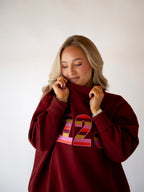 PRE-ORDER: The Stripe Signature Mockneck- Burgundy